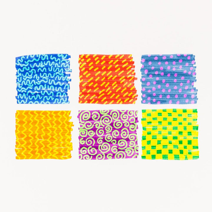 Set of colorful patterned scrunchies on a white background