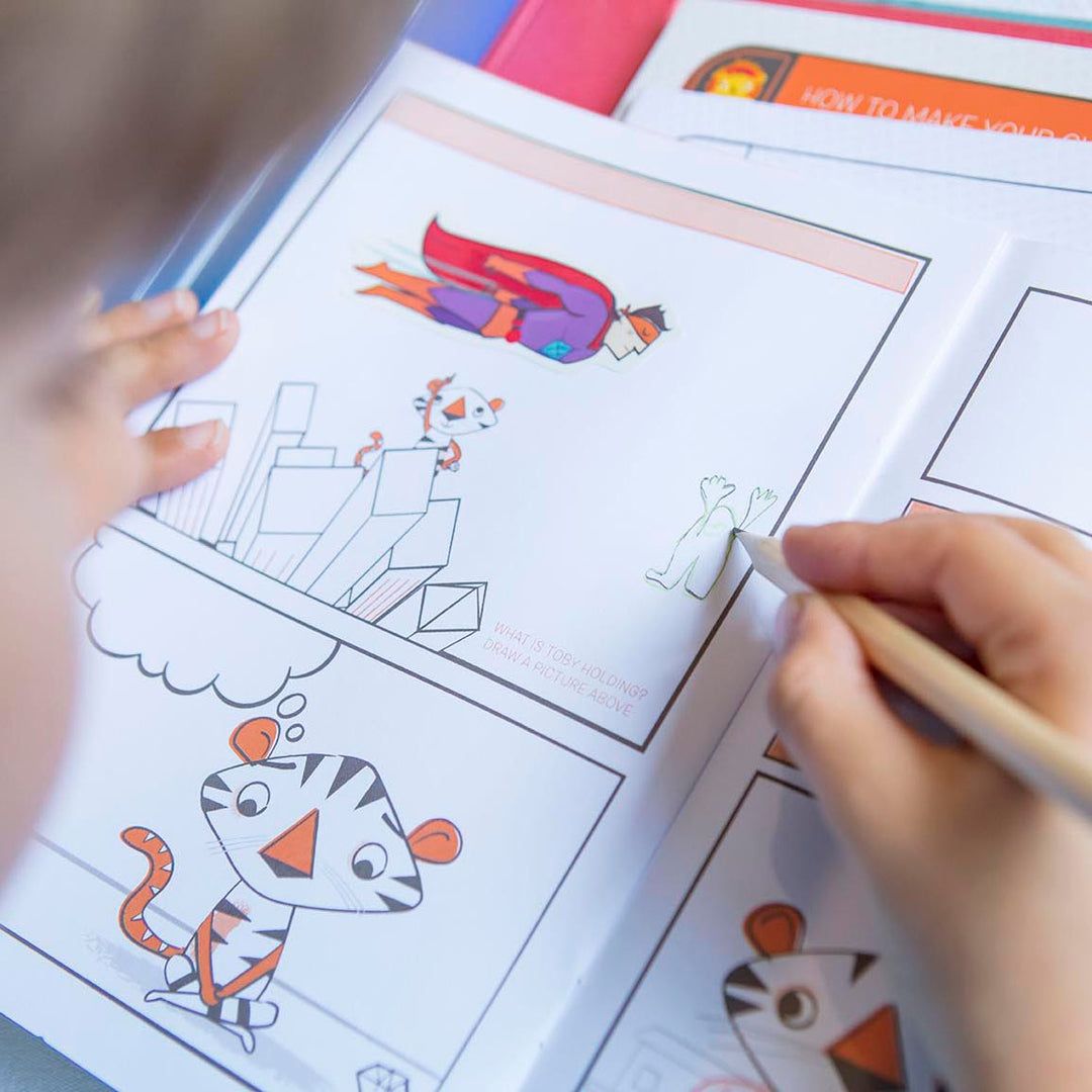 Child coloring a superhero and tiger illustration in a coloring book