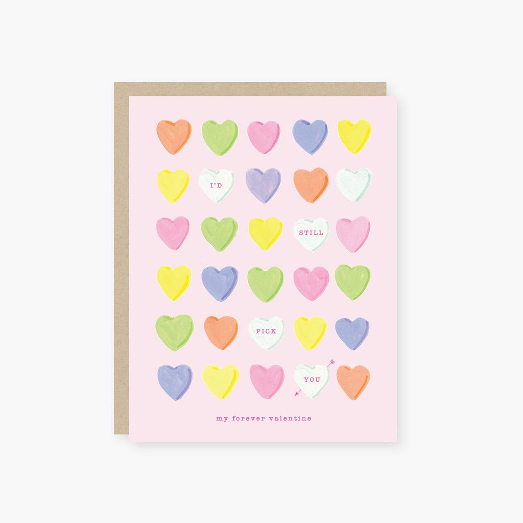 Greeting card with colorful heart pattern on a pink background
