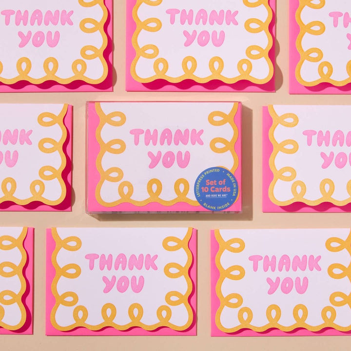 Set of 'THANK YOU' cards with pink and yellow design on a beige background