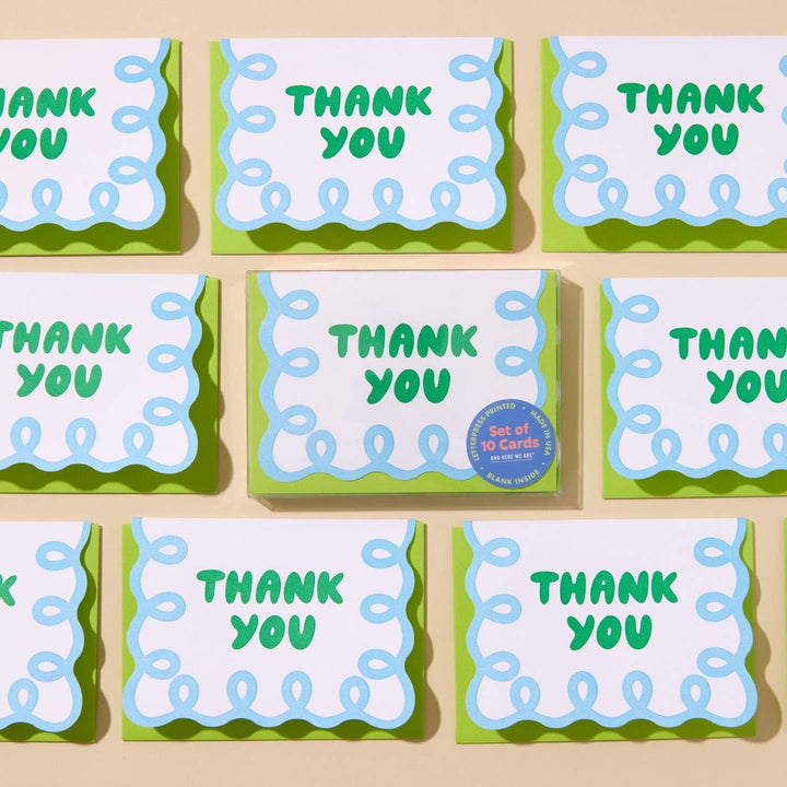 Set of 'THANK YOU' cards with green and blue design on a beige background