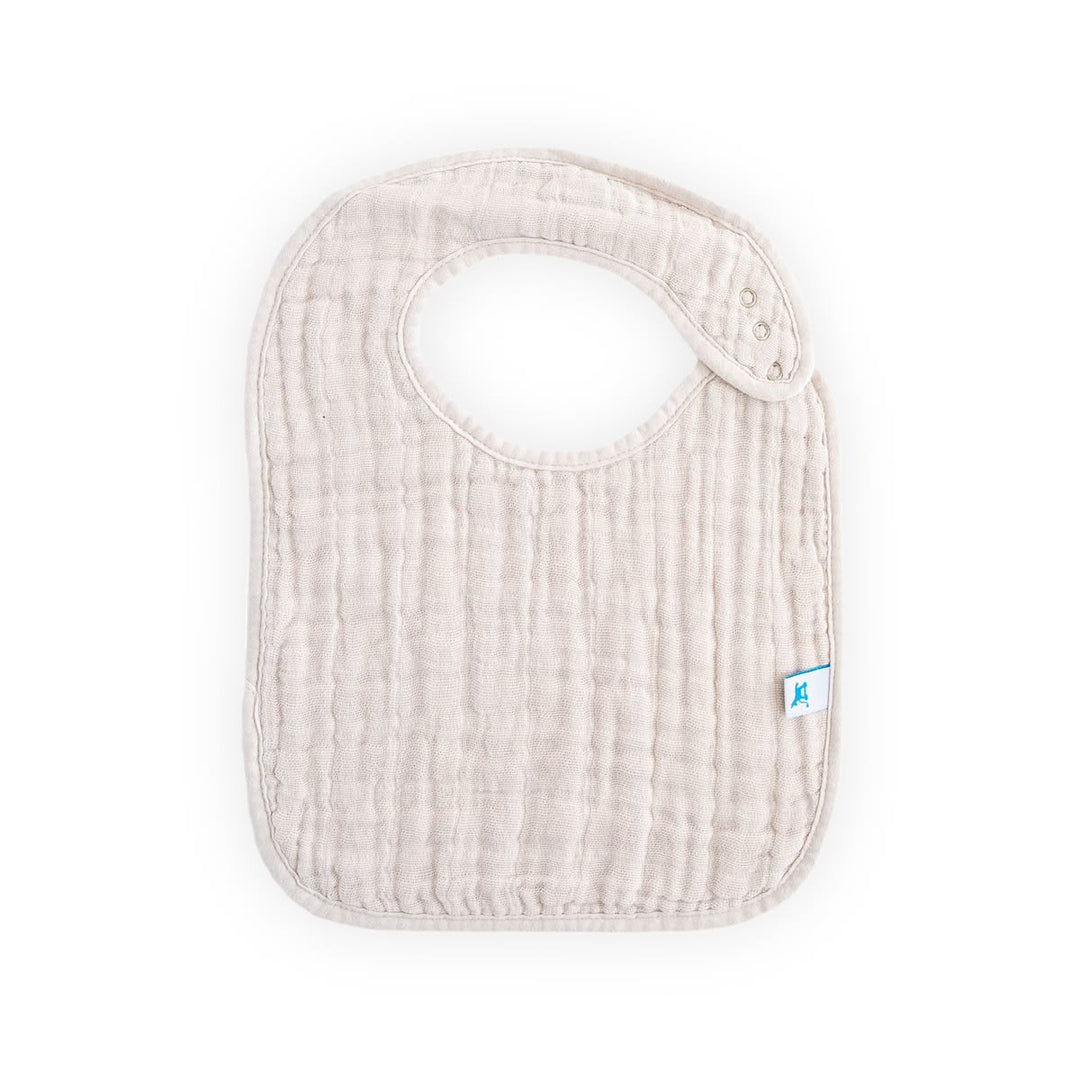 Beige baby bib with a brand logo on a white background