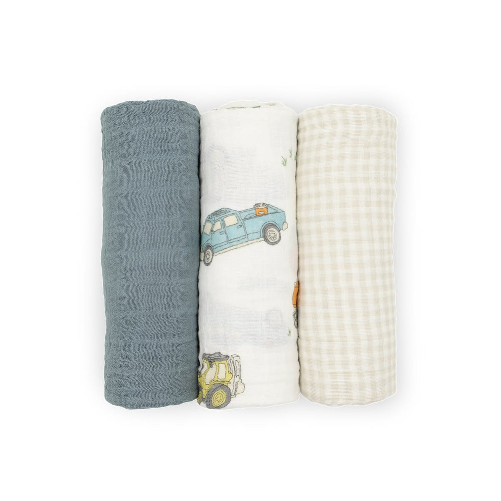 Three baby swaddle blankets with different textures and patterns on a white background