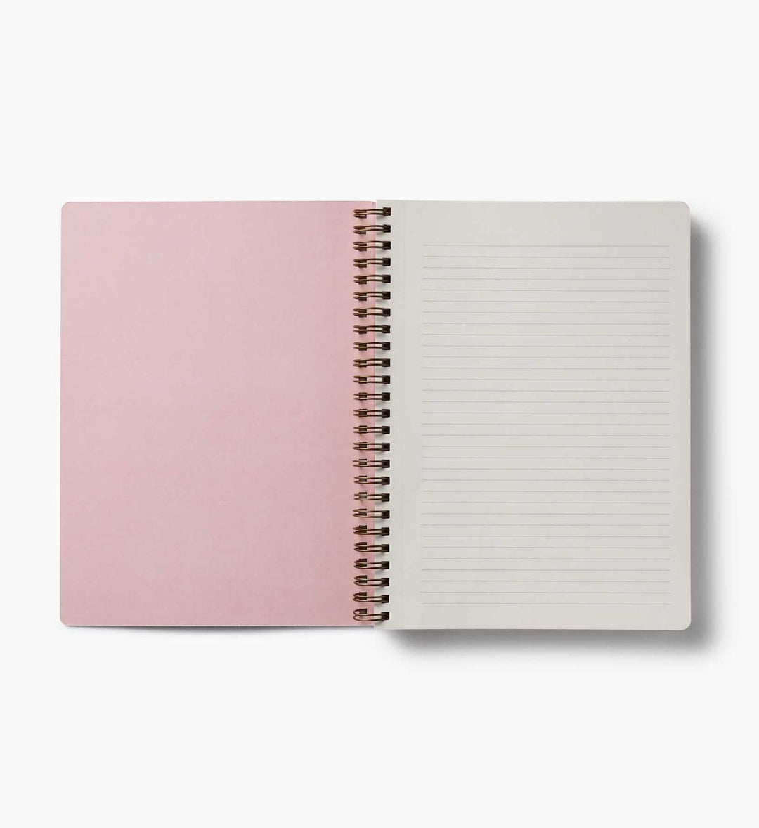 Open notebook with pink cover and white lined pages on a white background