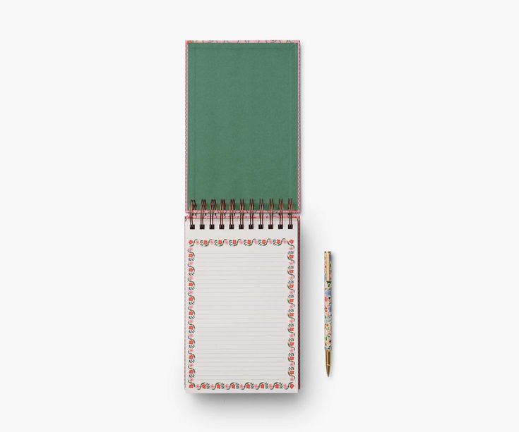 Green notepad with a pen on a white background