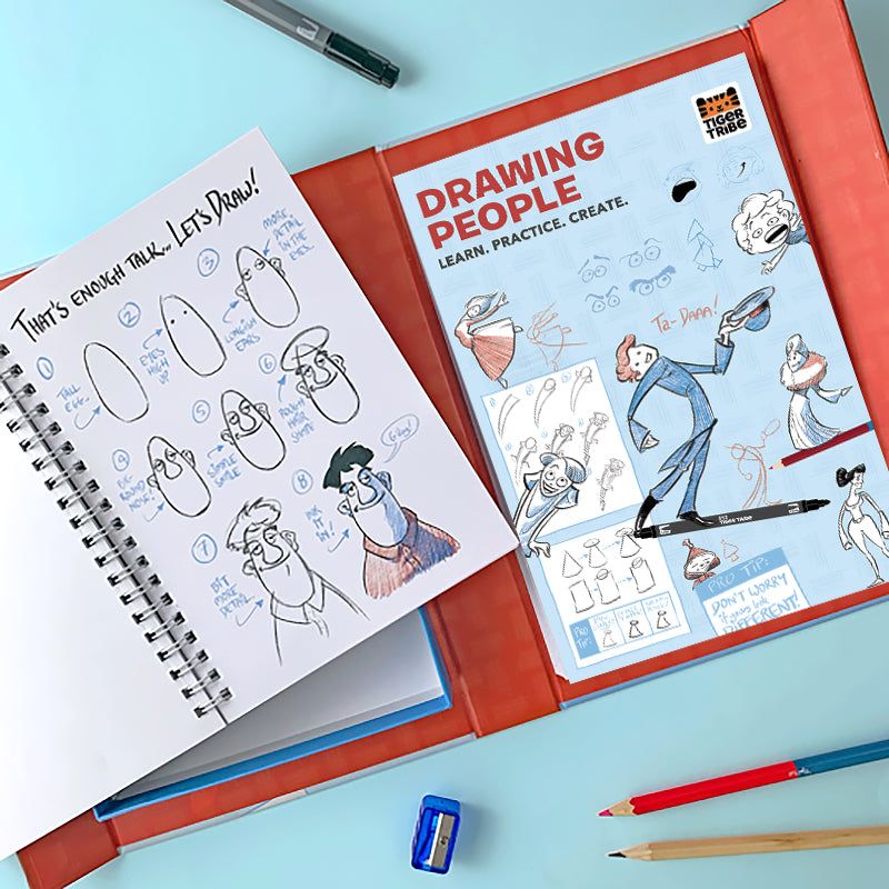 Open book on drawing people with illustrations and text, surrounded by drawing tools on a light blue background.