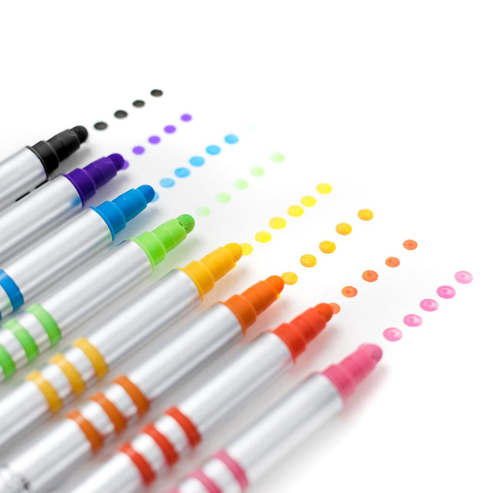 Set of colorful markers with colored caps on a white background
