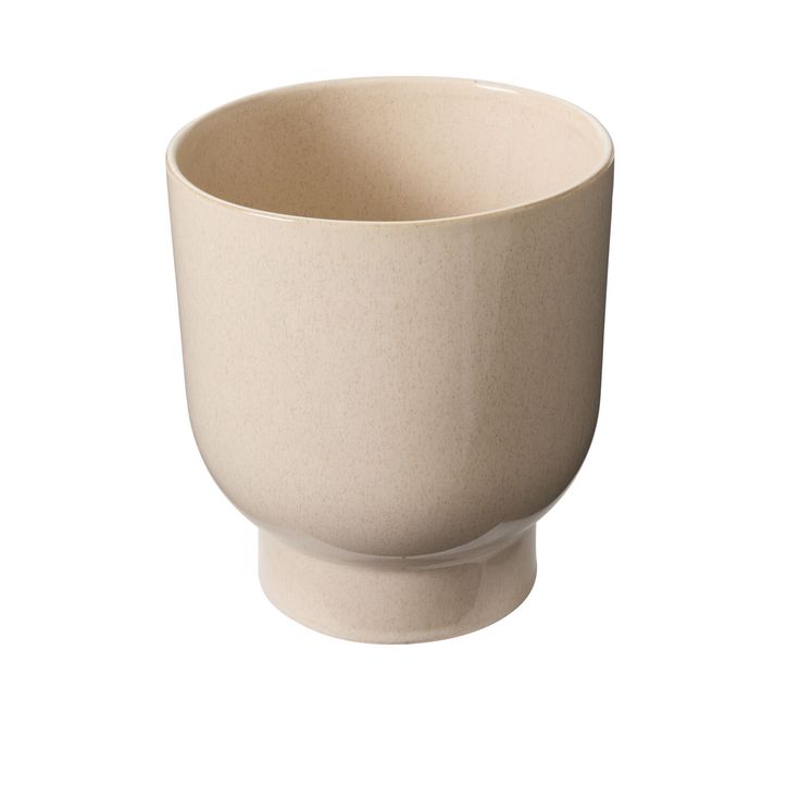 Beige ceramic cup on a white background