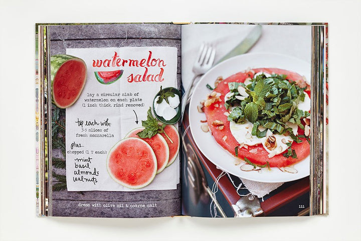 Open cookbook showing a recipe for watermelon salad with a photo and text.