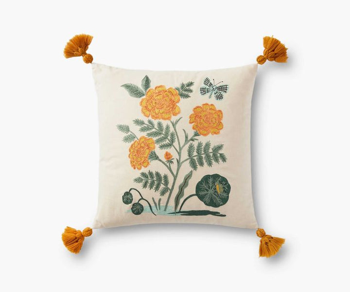 Decorative pillow with floral design and tassels on a white background