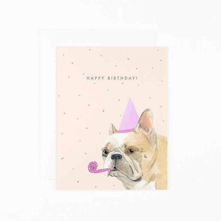 A birthday card featuring a watercolor illustration of a French bulldog wearing a pink party hat and blowing a pink party blower, with the text 'HAPPY BIRTHDAY!' on a pale pink background with small scattered confetti dots. A white envelope is partially visible behind the card.