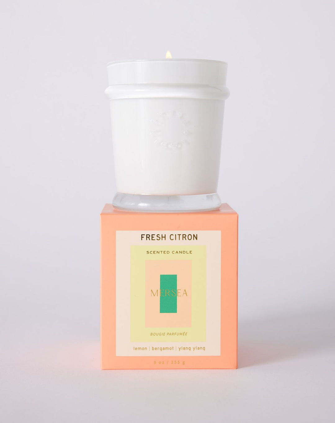 Scented candle with 'Fresh Citron' packaging on a white background