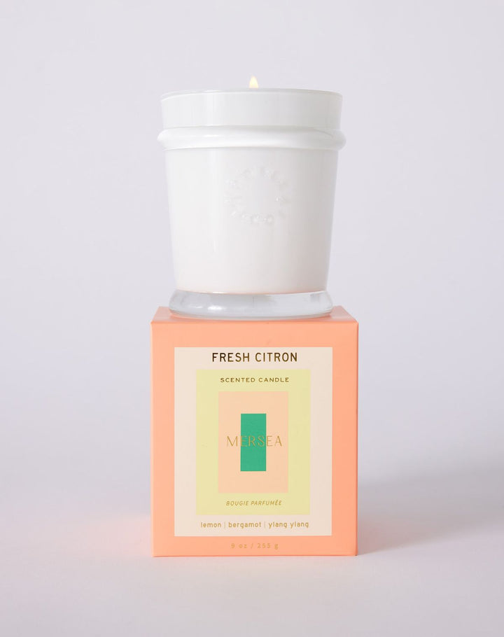 Scented candle with 'Fresh Citron' packaging on a white background