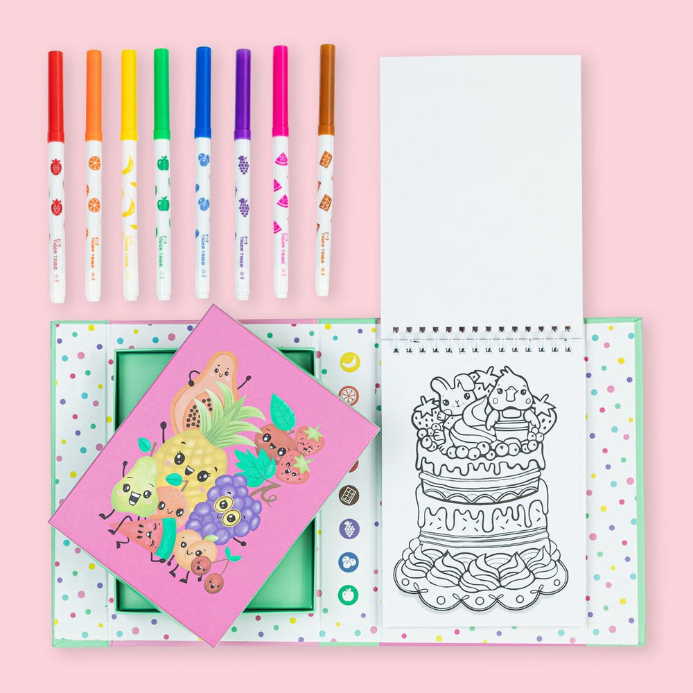 Coloring set with markers, coloring book, and coloring pages on a pink background