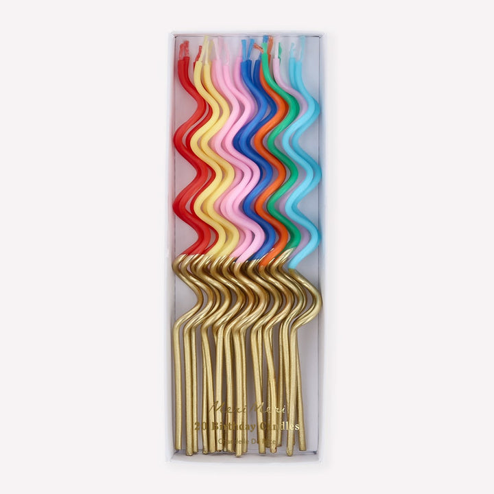 Set of colorful straws in a clear packaging on a white background