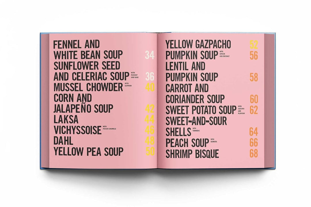 An open book or menu spread with a pink page listing soup names and numbers, photographed against a clean white background.
