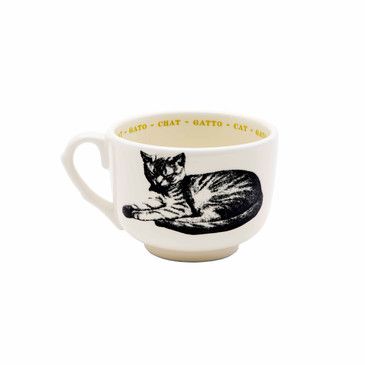 White mug with black cat illustration and text on a white background