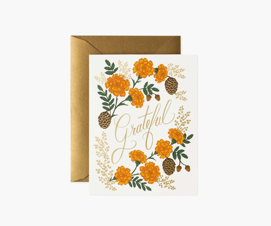 Greeting card with floral design and 'Grateful' text, featuring a brown envelope on a white background.