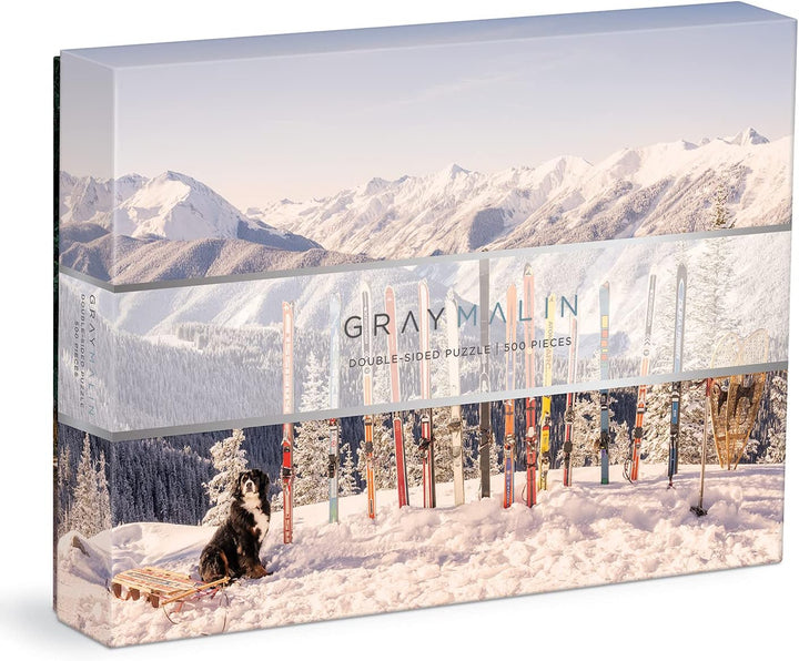 Gray Malin double-sided puzzle packaging with a snowy mountain and dog scene.