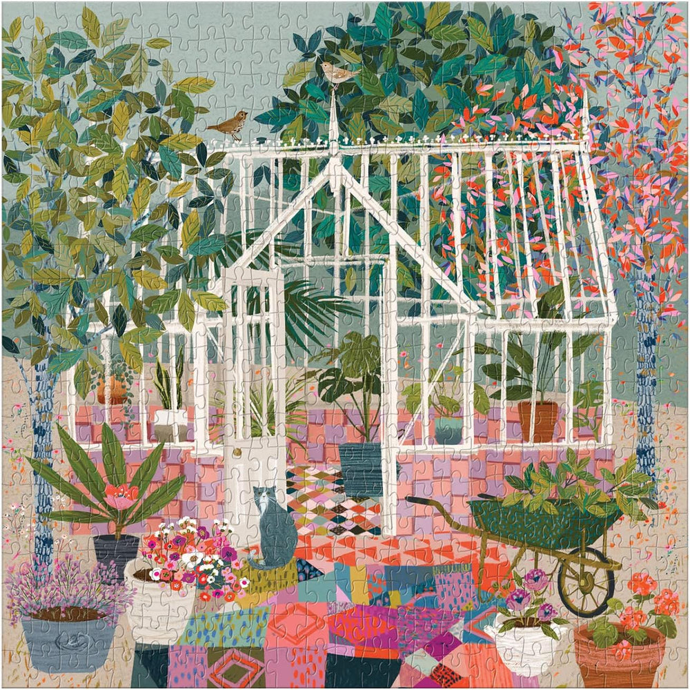 Colorful quilt with a white greenhouse and garden scene