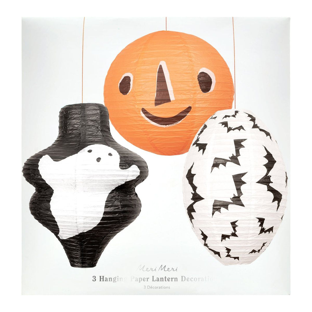 Three Halloween-themed paper lanterns on a white background