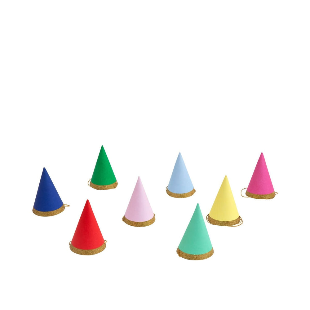 Set of colorful conical hats on a white background