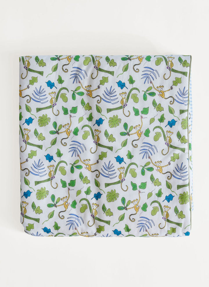 Fabric with monkey and leaf pattern on a white background