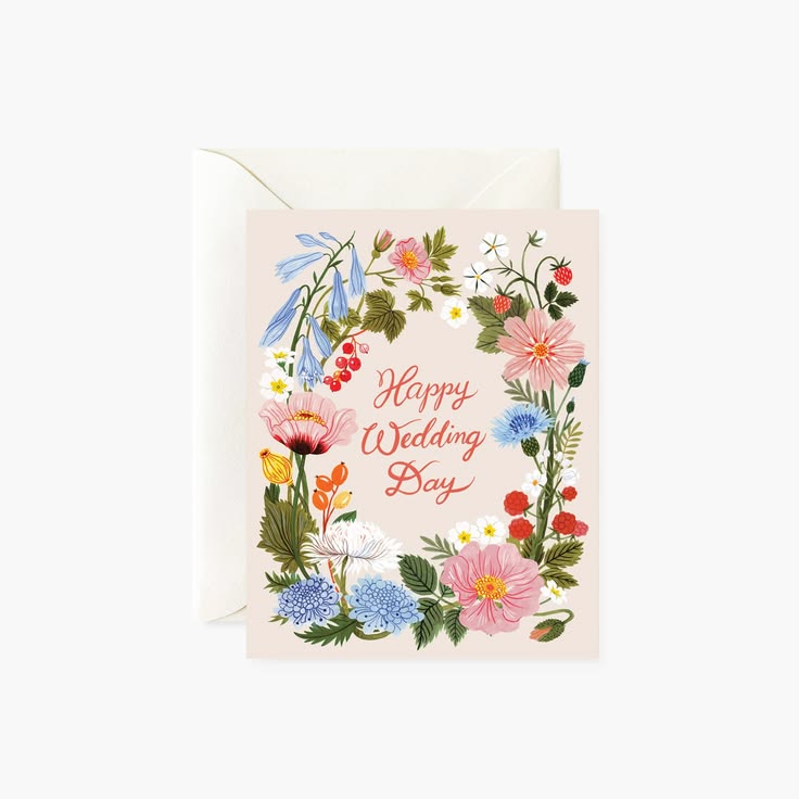 A floral 'Happy Wedding Boy' greeting card with a matching envelope, featuring a watercolor-style border of pink, blue, red, and yellow flowers on a cream background.