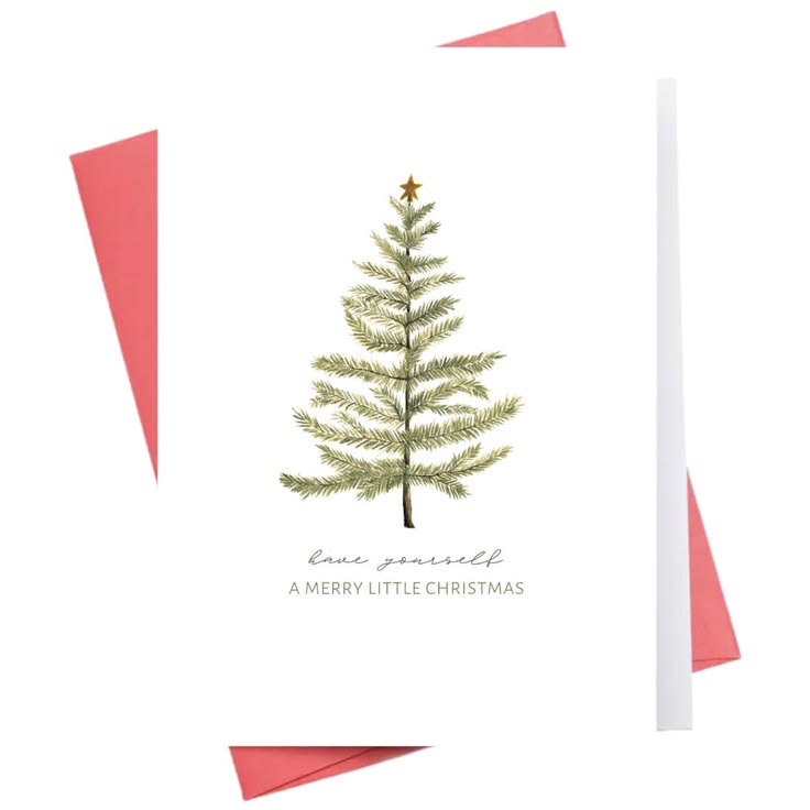 A white Christmas greeting card featuring a watercolor-style green tree with a gold star and the text 'love yourself A MERRY LITTLE CHRISTMAS'. Pink paper envelopes are partially visible behind the card on a white background.