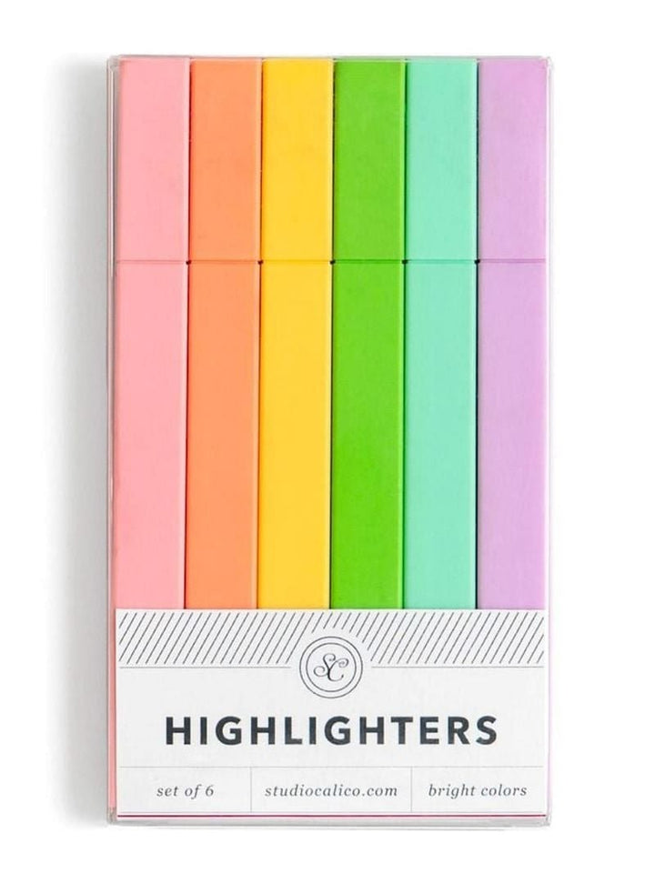 A set of six pastel highlighters in a clear plastic case with a white label that reads 'HIGHLIGHTERS' and 'set of 6'. The highlighters are arranged vertically in a rainbow-like sequence of pink, orange, yellow, green, mint, and lavender.