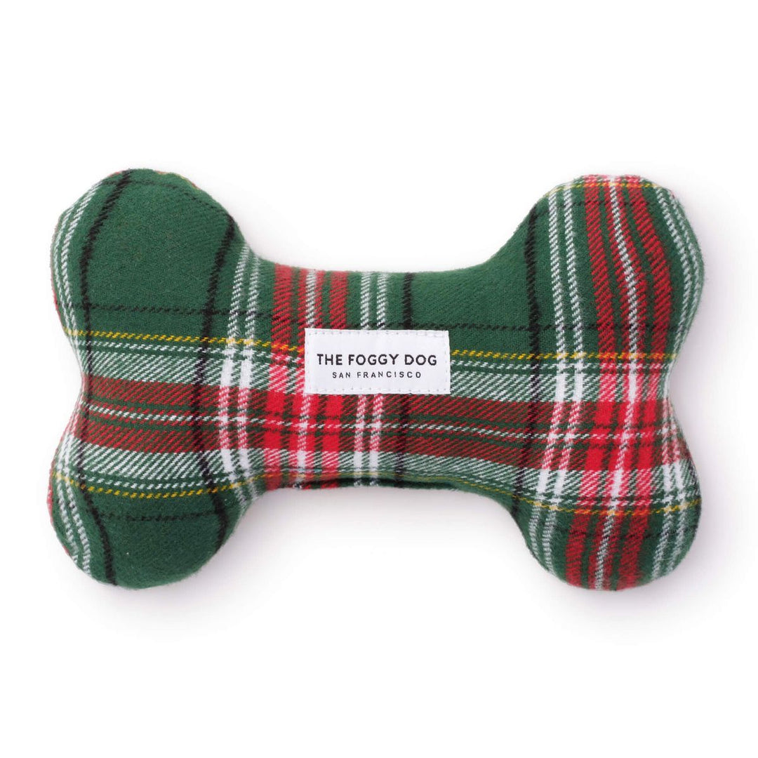 Plaid bone-shaped toy with 'The Foggy Dog' label on a white background