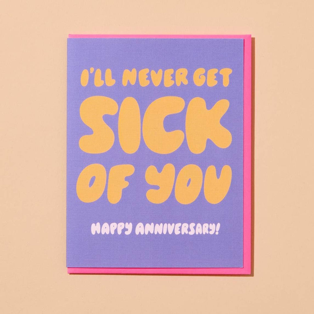 Card with 'I'll never get sick of you, happy anniversary!' text on a purple background with pink border.