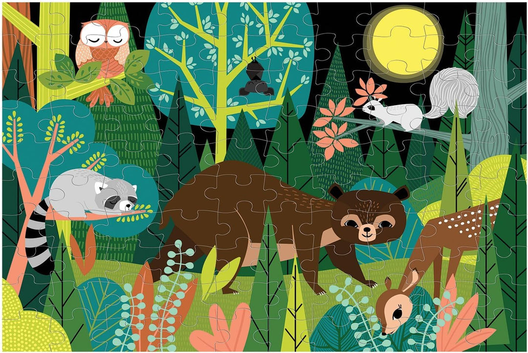 A completed children's jigsaw puzzle featuring a whimsical forest scene with animals including an owl, raccoon, bear, deer, squirrel, and a fox under a full moon.