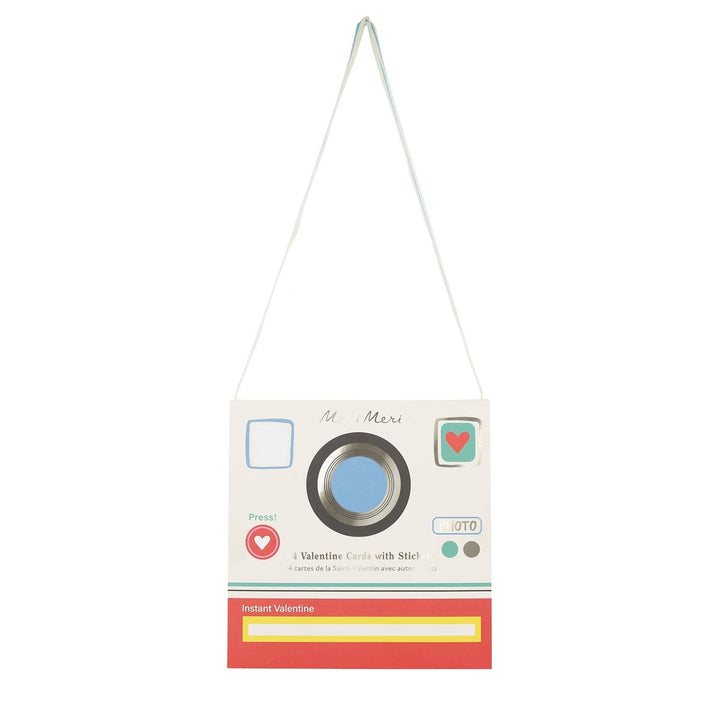 Vintage-style camera-shaped card with a string on a white background