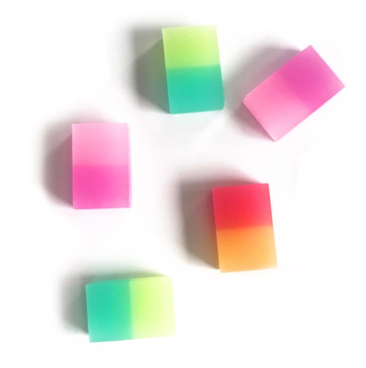 Colorful gradient erasers on a white background
