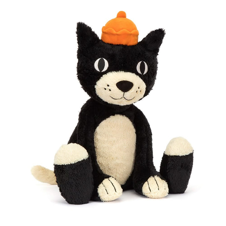 Black and white plush cat toy with a pumpkin hat on a white background
