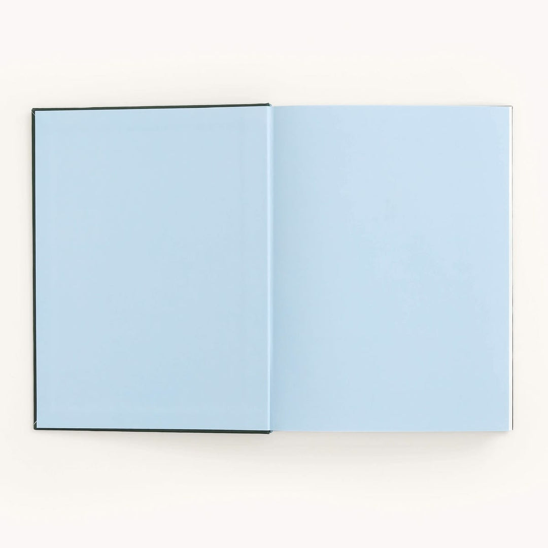 Open book with light blue pages on a white background