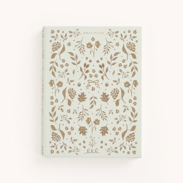 Notebook with floral pattern on a white background