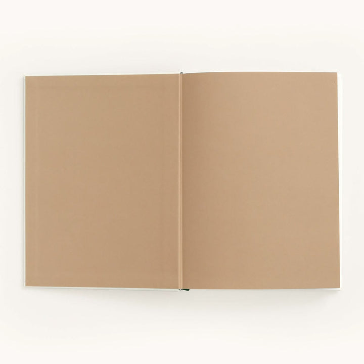 Open beige notebook on a white background
