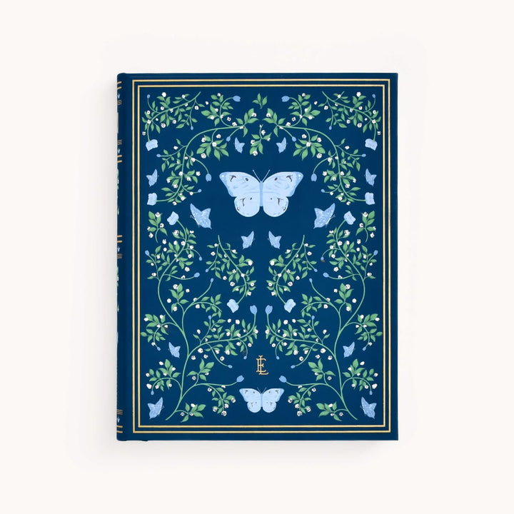 Decorative notebook with butterfly and floral design on a blue background