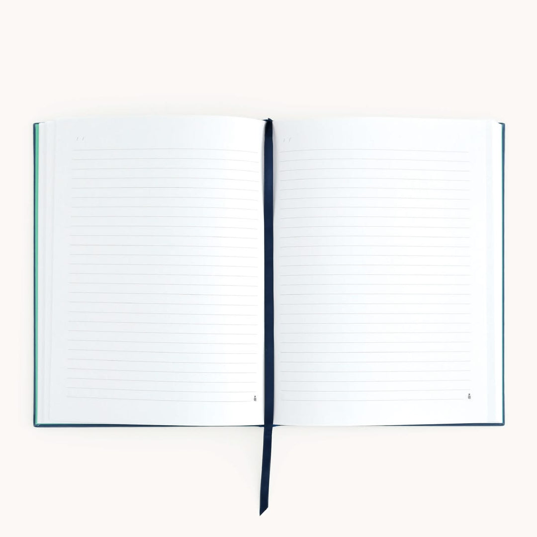 Open notebook with lined pages on a white background