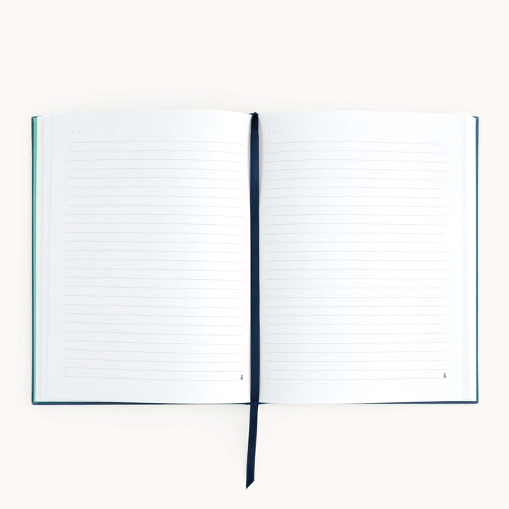 Open notebook with lined pages on a white background