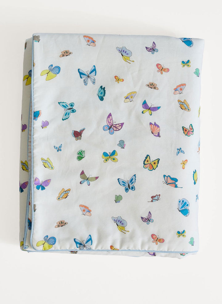 Baby blanket with colorful butterfly pattern on a white background