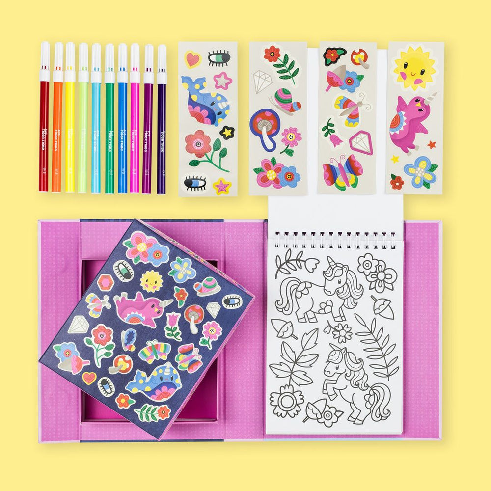 Coloring book, pencils, and sticker sheets on a yellow background