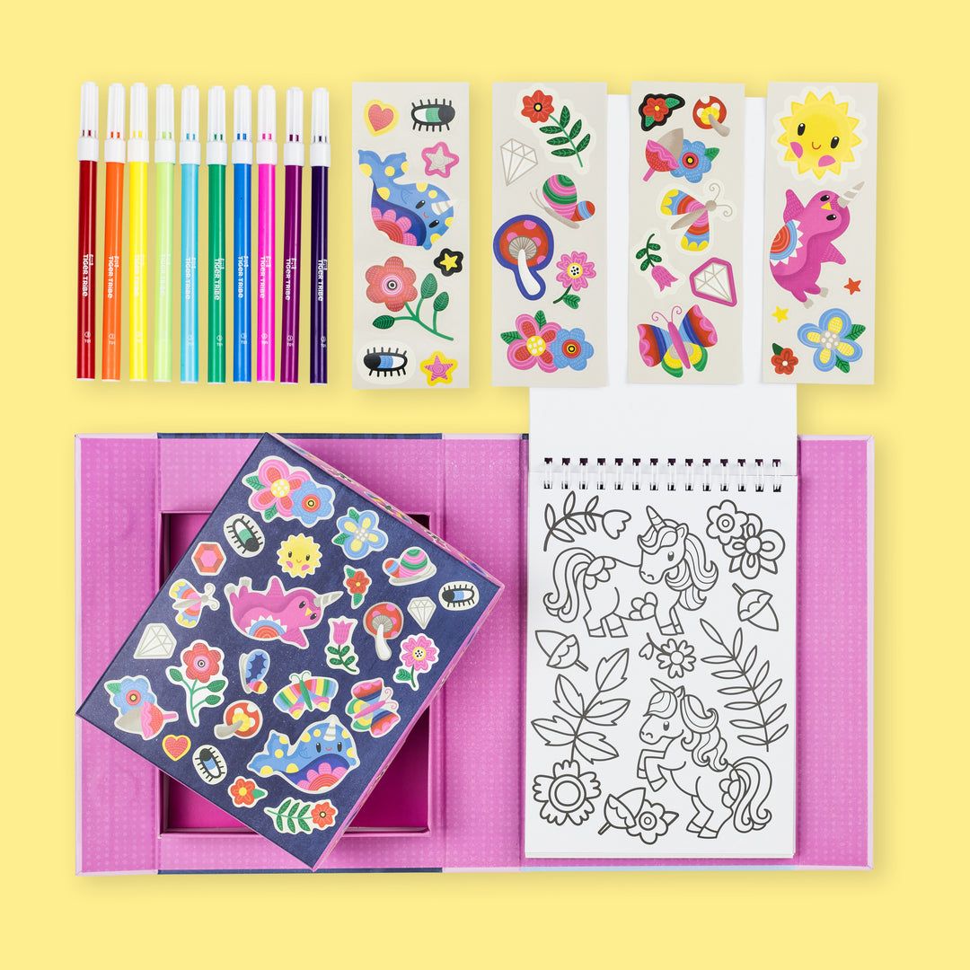 Coloring book, pencils, and sticker sheets on a yellow background