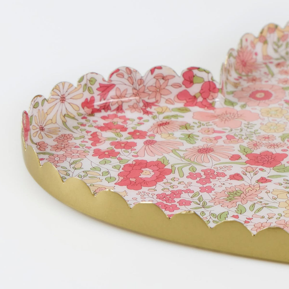 Floral-patterned tray with scalloped edge on a white background