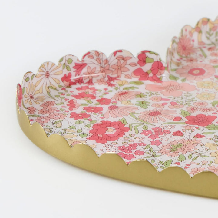 Floral-patterned tray with scalloped edge on a white background