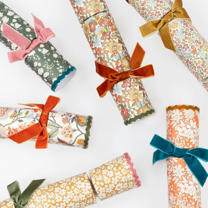 Decorative rolled-up papers with colorful ribbons on a white background