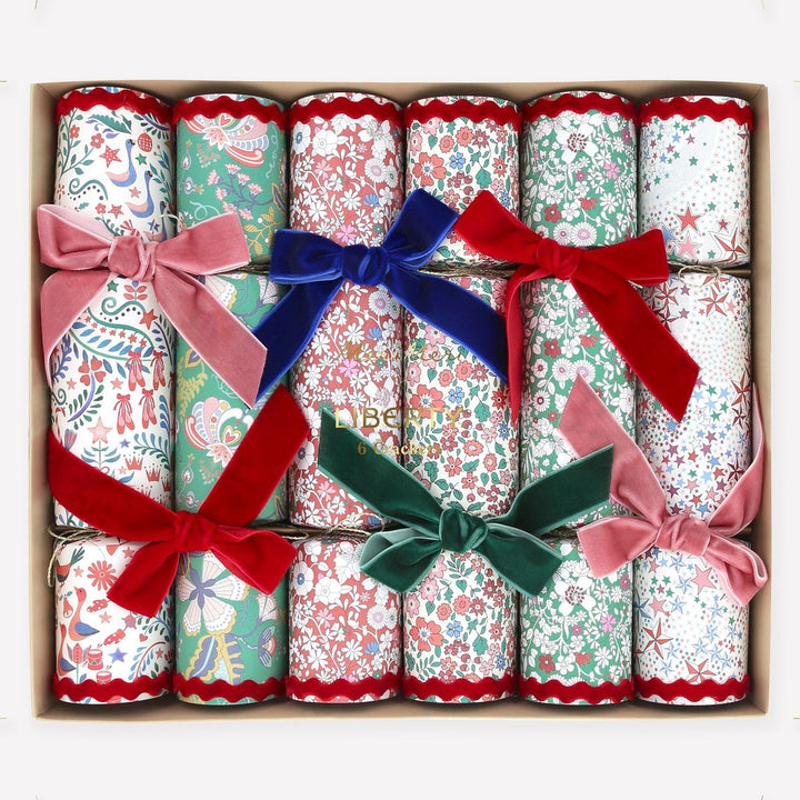 Decorative crackers with colorful bows in a box