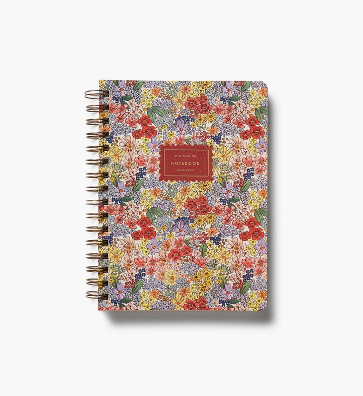 Floral patterned notebook with a red label on a white background